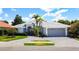Beautiful single story home with landscaped front yard and brick paved driveway at 4239 Corso Venetia Blvd, Venice, FL 34293
