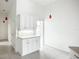 Clean kitchen with white cabinets, tile backsplash, and tile flooring at 4239 Corso Venetia Blvd, Venice, FL 34293