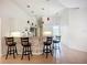 Modern kitchen with pendant lighting, breakfast bar, and updated appliances at 4239 Corso Venetia Blvd, Venice, FL 34293
