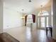 Spacious living room features tile flooring and decorative lighting fixtures at 4239 Corso Venetia Blvd, Venice, FL 34293