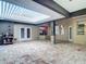 Enjoy the outdoor living space with a brick-paved patio and a covered, built-in kitchen and bar area at 4239 Corso Venetia Blvd, Venice, FL 34293