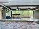 Close up shot of a bar and sink area in the outdoor covered kitchen, perfect for prepping food at 4239 Corso Venetia Blvd, Venice, FL 34293