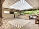 The outdoor kitchen offers granite countertops, stainless steel appliances, and a brick-paved patio at 4239 Corso Venetia Blvd, Venice, FL 34293