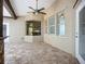 Relax on the paved outdoor patio that includes outdoor seating and views of the rear gardens at 4239 Corso Venetia Blvd, Venice, FL 34293