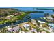Elevated view of waterfront home displaying its private dock, proximity to the canal, and picturesque neighborhood setting at 4361 Pompano Ln, Palmetto, FL 34221