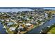 High-angle shot of waterfront property revealing canal access, private dock, and the neighborhood's scenic water features at 4361 Pompano Ln, Palmetto, FL 34221