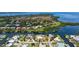 Stunning aerial perspective showcasing home's prime waterfront location, private dock, and surrounding serene canals at 4361 Pompano Ln, Palmetto, FL 34221
