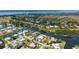 Aerial view of home showcasing location on canal with private dock and beautiful water access in a desirable neighborhood at 4361 Pompano Ln, Palmetto, FL 34221