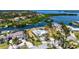 Aerial view of waterfront home highlighting private pool, lush landscaping, and convenient boat dock access at 4361 Pompano Ln, Palmetto, FL 34221