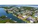 Waterfront home featuring direct boating access to the Gulf of Mexico, with lush tropical landscaping, and circular drive at 4361 Pompano Ln, Palmetto, FL 34221