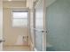 Bright bathroom featuring tiled shower/tub, a window, and a toilet at 4361 Pompano Ln, Palmetto, FL 34221