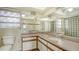 Bathroom features dual sinks with expansive mirror, and glass block window for natural light at 4361 Pompano Ln, Palmetto, FL 34221