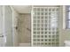 Bathroom with glass block partition and shower at 4361 Pompano Ln, Palmetto, FL 34221