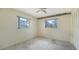 Bedroom featuring ceiling fan, windows and closet at 4361 Pompano Ln, Palmetto, FL 34221
