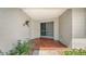 Front entryway with brick floors and a double screen door at 4361 Pompano Ln, Palmetto, FL 34221