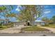Home with a metal roof, manicured landscaping, and a two-car garage at 4361 Pompano Ln, Palmetto, FL 34221