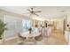 Bright open kitchen and breakfast area featuring tile floors, stainless appliances, and breakfast bar seating at 4361 Pompano Ln, Palmetto, FL 34221