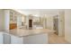 Spacious kitchen layout featuring stone countertops, stainless steel appliances, and tile flooring at 4361 Pompano Ln, Palmetto, FL 34221