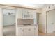 Cozy kitchen setup includes a microwave and range with cabinetry, tile floors, and neutral colors at 4361 Pompano Ln, Palmetto, FL 34221