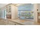 This kitchen boasts a sink and a window view of the pool area for pleasant tasks at 4361 Pompano Ln, Palmetto, FL 34221