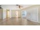 Living room offers neutral paint, tile floors, a glass sliding door, and plenty of natural light at 4361 Pompano Ln, Palmetto, FL 34221