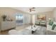 Bright living room featuring tile floors, modern decor, and sliding door access to the outdoor patio at 4361 Pompano Ln, Palmetto, FL 34221