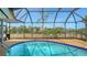 A screened pool with views of the canal offers a serene backyard oasis for relaxation and enjoyment at 4361 Pompano Ln, Palmetto, FL 34221
