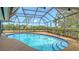 Screened pool featuring a paver deck and water views at 4361 Pompano Ln, Palmetto, FL 34221