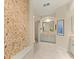 Elegant bathroom with a mosaic wall, a glass-enclosed shower, and a vanity with ample counter space at 4584 Tuscana Dr, Sarasota, FL 34241
