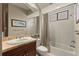 Cozy bathroom with vanity, mirror, and shower-tub combination with neutral tones at 4584 Tuscana Dr, Sarasota, FL 34241