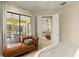 Bedroom with chaise lounge and outdoor access leading to a screened patio and pool at 4584 Tuscana Dr, Sarasota, FL 34241