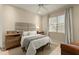 Comfortable bedroom features a queen-size bed, nightstands, and a bright window at 4584 Tuscana Dr, Sarasota, FL 34241