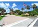 Inviting entrance to the community featuring brick pavers, landscaping, and decorative towers at 4584 Tuscana Dr, Sarasota, FL 34241