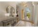 Welcoming foyer featuring decorative tile flooring, high ceilings, and a stylish console table at 4584 Tuscana Dr, Sarasota, FL 34241