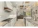 Bright kitchen with modern appliances and granite countertops seamlessly connecting to a cozy living area at 4584 Tuscana Dr, Sarasota, FL 34241