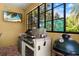 Outdoor kitchen features a stainless steel gas grill and smoker with a garden view at 4584 Tuscana Dr, Sarasota, FL 34241