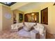 Cozy outdoor living space with fire pit, curved sofas, and view through window at 4584 Tuscana Dr, Sarasota, FL 34241
