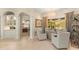Bright sitting area with neutral tones, stylish furniture, and bay window offering beautiful outdoor views at 4584 Tuscana Dr, Sarasota, FL 34241