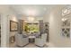 Bright sitting area with neutral tones, stylish furniture, and bay window offering beautiful outdoor views at 4584 Tuscana Dr, Sarasota, FL 34241