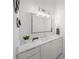 Stylish bathroom featuring sleek vanity with ample storage, a modern mirror and attractive decor at 4726 Rivetta Ct, Sarasota, FL 34231