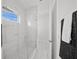 Modern bathroom featuring a glass-enclosed shower with sleek white marble and stylish fixtures at 4726 Rivetta Ct, Sarasota, FL 34231