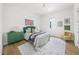 Bright bedroom with ample light, hardwood floors, a unique shag rug, and tastefully coordinated decor at 4726 Rivetta Ct, Sarasota, FL 34231