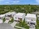 Modern, two-story home featuring clean lines, wood accents, a landscaped yard and convenient driveways at 4726 Rivetta Ct, Sarasota, FL 34231