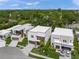 Modern, two-story home featuring clean lines, wood accents, a landscaped yard and convenient driveways at 4726 Rivetta Ct, Sarasota, FL 34231