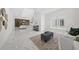 Spacious living room features marble floors, modern decor, and staircase to the second floor at 4726 Rivetta Ct, Sarasota, FL 34231