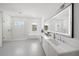Luxurious bathroom with a large soaking tub, walk-in shower, and double vanity with elegant fixtures at 4726 Rivetta Ct, Sarasota, FL 34231