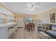 Open living space featuring an island with barstools and a view of the dining and living area at 475 Benjamin Franklin Dr # 211, Sarasota, FL 34236