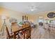 Cozy living room featuring a dining table, comfortable seating, and stylish decor, perfect for relaxation and entertaining at 475 Benjamin Franklin Dr # 211, Sarasota, FL 34236