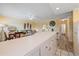 Bright living area showcasing an open floor plan, connecting the kitchen, dining area, and living space for seamless living at 475 Benjamin Franklin Dr # 211, Sarasota, FL 34236
