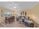 Open living space with a dining area, comfortable seating, and natural light, creating a welcoming atmosphere at 475 Benjamin Franklin Dr # 211, Sarasota, FL 34236